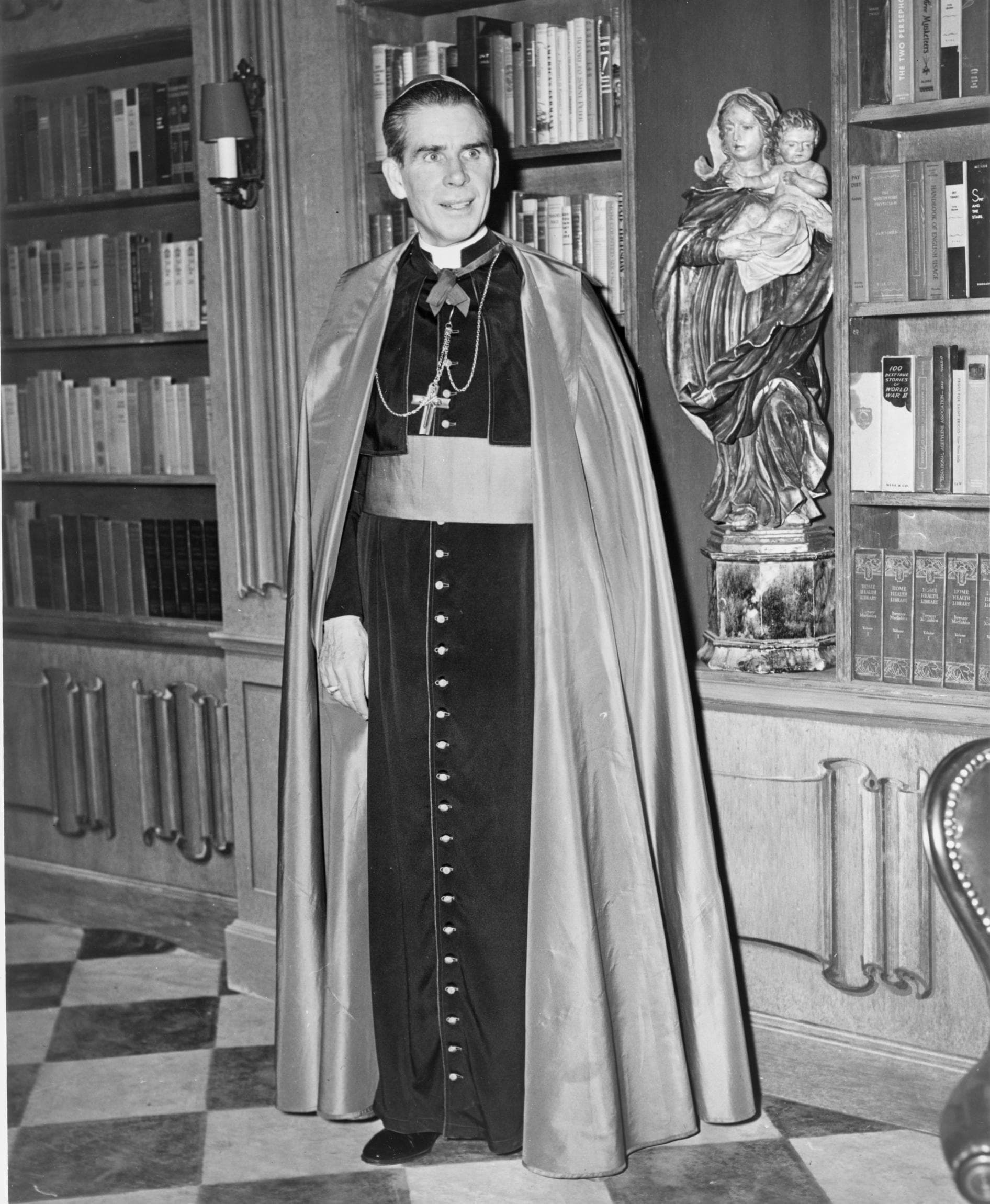 Black-and-white portrait of Archbishop Fulton J. Sheen in cassock and pectoral cross, 1952